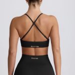 Super Sculpt Seamless Cross-Back Sports Bra in Black - Image 3