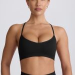 Super Sculpt Seamless Cross-Back Sports Bra in Black - Image 6