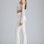 Petite Metallic Belted Mid-Rise Flared Trousers in Ivory - Image 3
