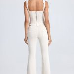 Petite Mid-Rise Flared Jeans in Ecru - Image 2