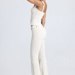 Petite Mid-Rise Flared Jeans in Ecru - Image 3