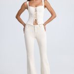 Petite Mid-Rise Flared Jeans in Ecru - Image 6