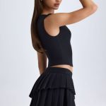 Layered Pleated Low-Rise Mini Skirt in Black - Image 4