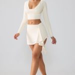 Slinky Jersey Mid Rise Ruffle Layer Mini Skirt in Ivory - Image 6