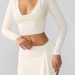 Slinky Jersey Mid Rise Ruffle Layer Mini Skirt in Ivory - Image 7
