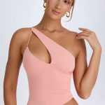 Asymmetric Cut-Out Top in Apricot Pink - Image 5